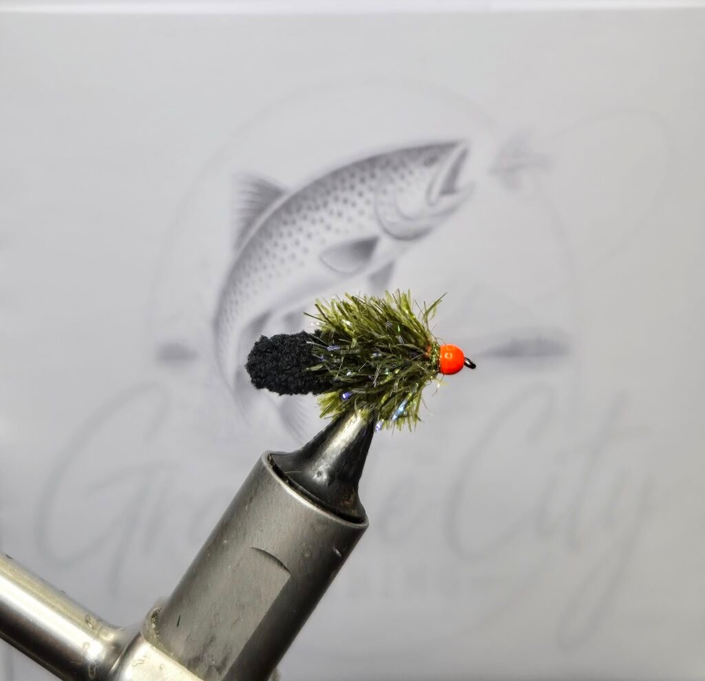 Olive and black Ally Mop Fly with orange head for trout fishing